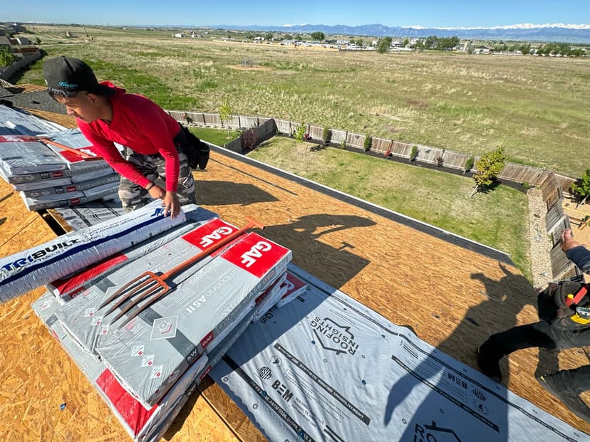 Virtuous Roofing crew on a roof in Colorado